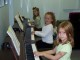 Photo: Kids: Three Class Piano Students...