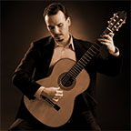 Photo of guitar teacher Eddie Healy with guitar.