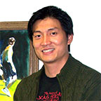 Photo of guitar teacher King Kun Ng with guitar student.