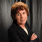 Photo of piano teacher Vicki Gray at piano.